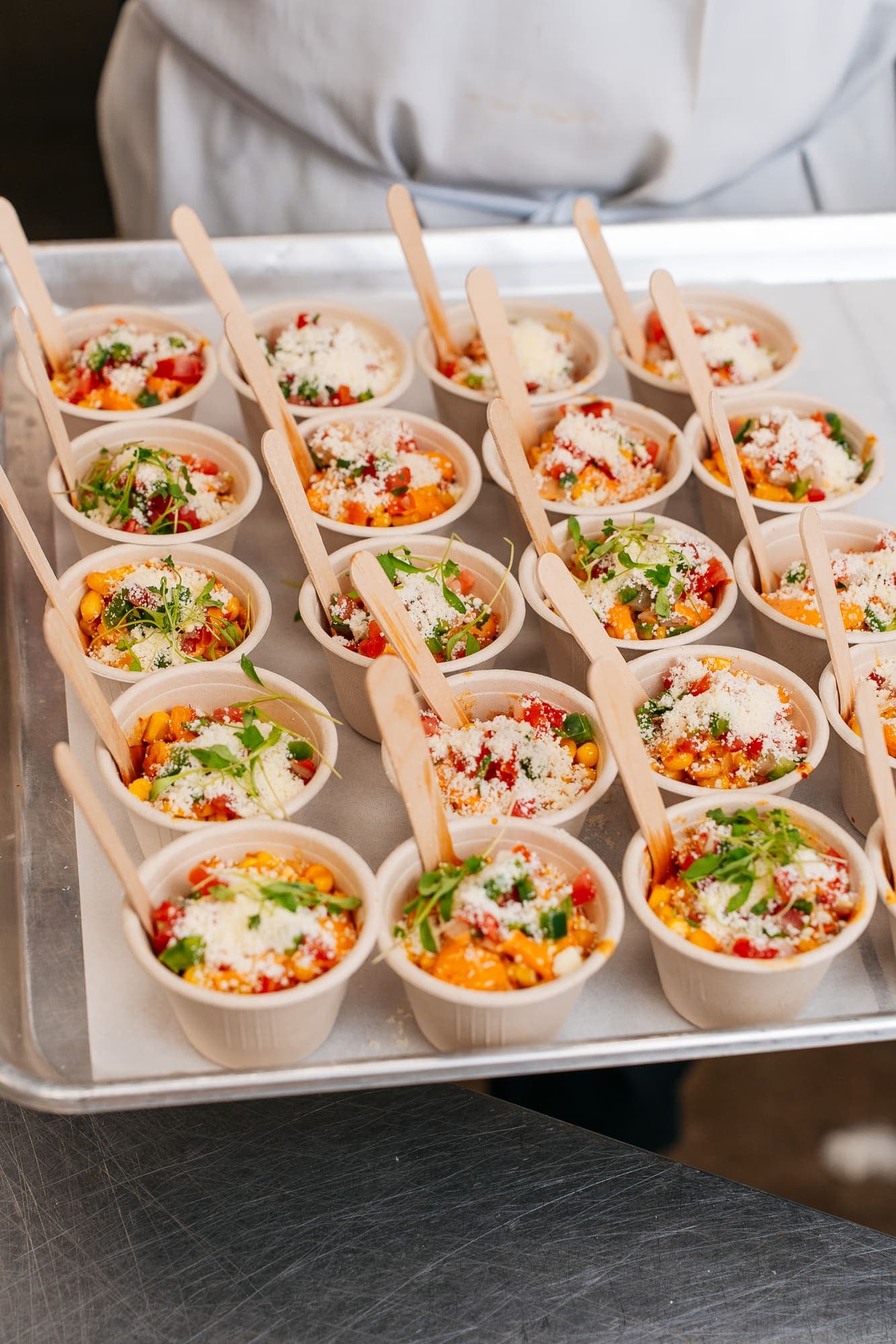 Street corn cups with cotija and wooden spoons
